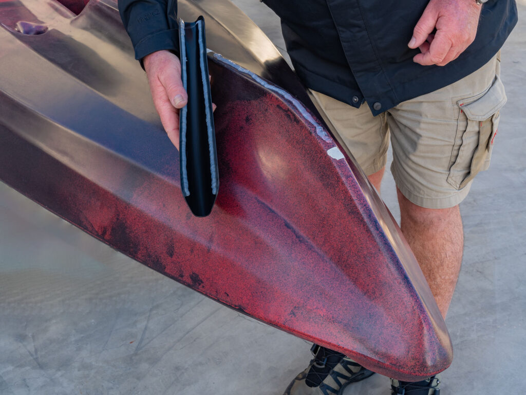 Apply marine Goop or suitable adhesive to the edges of the Bumper Bro and kayak keel
