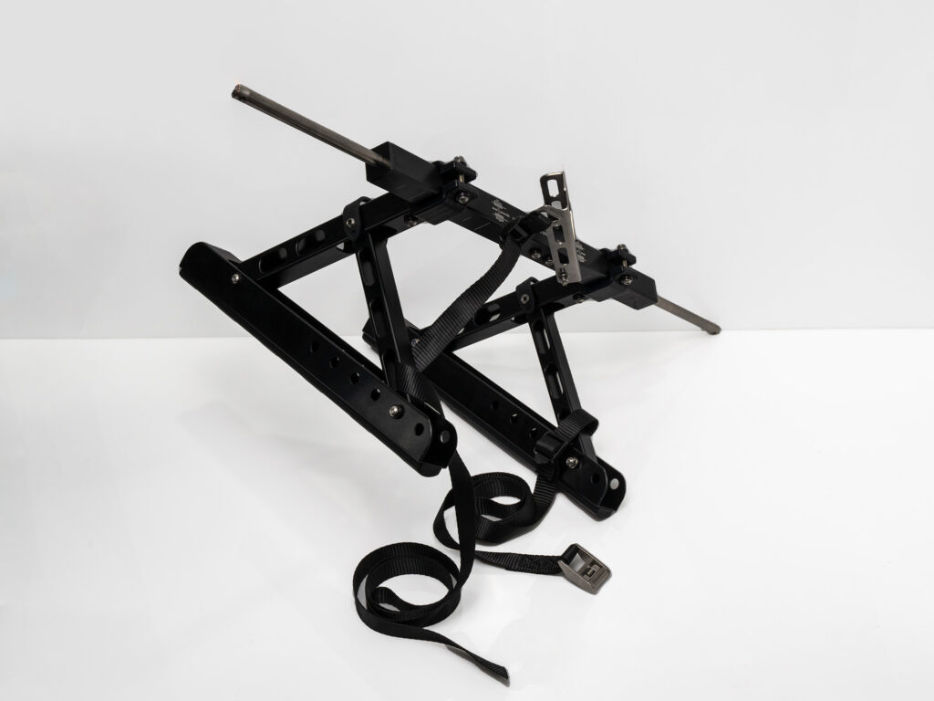 Run the Kimmi Cart tiedown straps through the middle or top slot of the height adjustment arms