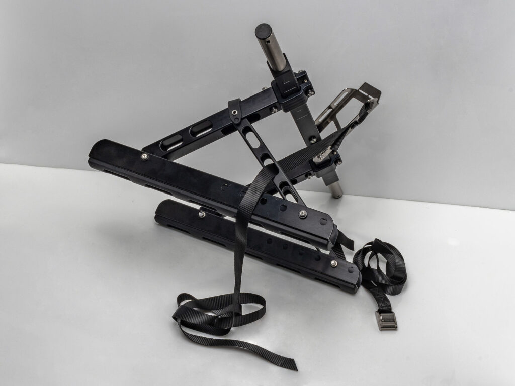 Run the Kimmi Cart tiedown straps through the middle or top slot of the height adjustment arms