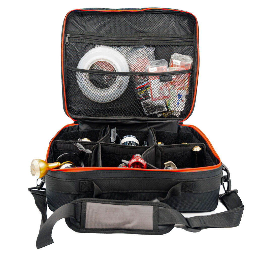 Meet the Catch 6 Compartment Reel Bag, your ultimate companion in sleek black. Flip open the lid and marvel as it showcases your plumbing arsenal—wrenches and fittings all organized to perfection in its multiple compartments. Need a spot for those smaller essentials? The zippered pockets have got you covered, ensuring nothing gets lost on the job.