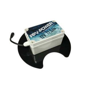 Check out this slick setup: a rectangular FPV Power battery pack, boasting 12V and 17.5Ah, chilling right on the BerleyPro Batterang Bro's sleek circular black platform. It's got a sturdy black cable hooked up on the side, ready to power up your adventure. Perfect for those who crave efficiency and style on the water!.