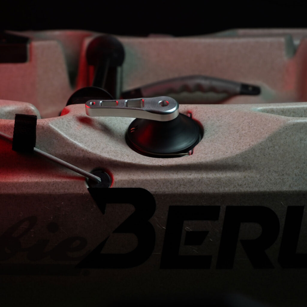 Get a load of this close-up shot, folks! Feast your eyes on the Hobie® kayak cockpit featuring our Outback / Compass Raised Aluminium Steering Handle designed exclusively for Hobie®. It pairs seamlessly with the pedal drive system, standing out in sleek silver among black components under that perfectly moody lighting. A real game-changer for your on-water experience!.