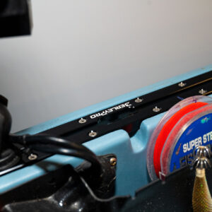 Here's a close-up shot of your ultimate fishing machine decked out with our top-of-the-line Upgraded Billet Aluminum Track Mounts combined seamlessly with the GearTrac system for unbeatable versatility. Plus, feast your eyes on the sleek "Super Stealth" fishing line spool and that perfectly poised lure ready to reel in the big ones. Your kayak never looked so fierce!.