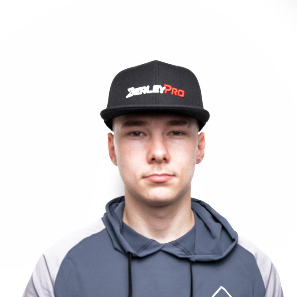 In true BerleyPro style, this individual stands confidently against a crisp white backdrop, rocking the iconic BerleyPro Cap. Paired perfectly with a hoodie, it's all about repping that signature logo with flair and attitude.