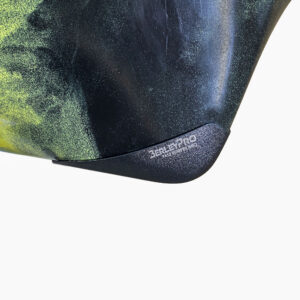 Check out this awesome close-up of the black "Bumper Bro Kayak Keel Guard" resting sleekly on a vibrant yellow and green marbled surface. It's the ultimate protection your kayak deserves!.