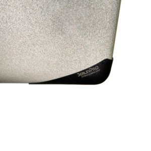 Feast your eyes on this close-up shot of a textured surface showcasing the indomitable black corner guard, branded with "DELPRO" in style. It's a beast akin to the rugged strength you'd find in our Bumper Bro Kayak Keel Guard.