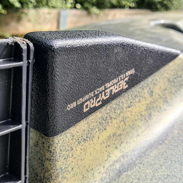 Check this out: up close and personal with our textured black Trailer Pro Titan 13.5 Propel Back Bumper Pro! Slapped onto that green kayak, it's not just looking tough—it’s dishing out serious protection where your yak needs it most. Think of it as a hardcore bumper bro or the ultimate keel guard—ready to cop those knocks, scrapes, and rough landings so your pride and joy stays adventure-ready.