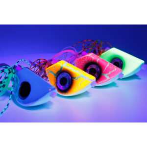 Check out these Four Catch Beady Eye Kabura Jigs! With their neon colors and signature black circle "beady eyes," these jigs look totally awesome lined up on a reflective surface under that vibrant blue light. They're not just tackle; they're eye-catching pieces geared up for epic fishing adventures.