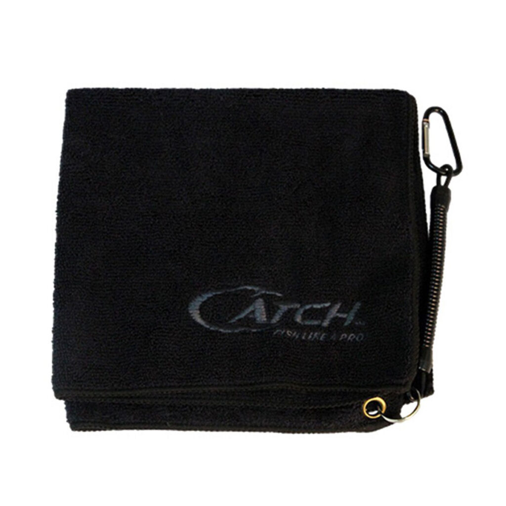 Introducing the ultimate companion for every roving angler: The Catch Fishing Towel in sleek black, boasting a refined gray embroidered "CATCH" logo. It’s not just a towel; it’s your new sidekick, equipped with a carabiner and retractable clip to keep you on the move without missing a catch.
