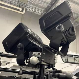 Get up close and personal with a pair of mounted Garmin Visors, casting their futuristic glow in an industrial-chic setting. It's like stepping into the future with these sleek visor-style light fixtures leading the way!.