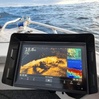 The Garmin Visors device is your trusty shipmate, showcasing essential nautical data right on your boat while the ocean's waves dance gracefully in the background.