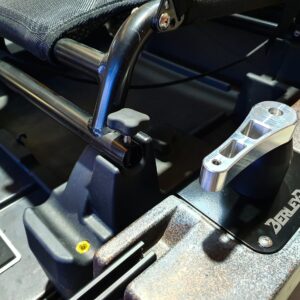 Check out this awesome close-up of the Native Watercraft Slayer 12.5 Max's upgraded Aluminum Steering Handle and Bush. It's secured perfectly against the bush-lined backdrop and seamlessly attached to the kayak's railing system. Time to take your kayaking experience to another level with precision steering!.