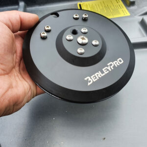 Check this out! Here’s someone gripping a sleek, round, black BerleyPro part, complete with multiple bolts. It’s the ultimate upgrade for your Native Watercraft T-Lock Steering system. Perfectly designed for those looking to take their watercraft setup to the next level!.