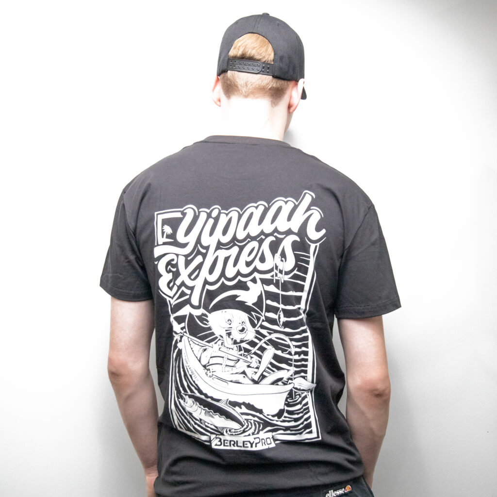 Rocking a sleek black cap and the BerleyPro Yipaah Express T-Shirt, this legend brings together style and fun effortlessly. The shirt is decked out with a cool cartoon character cruising in a boat graphic, making it the ultimate gear for anyone who loves to blend adventure with swag!.