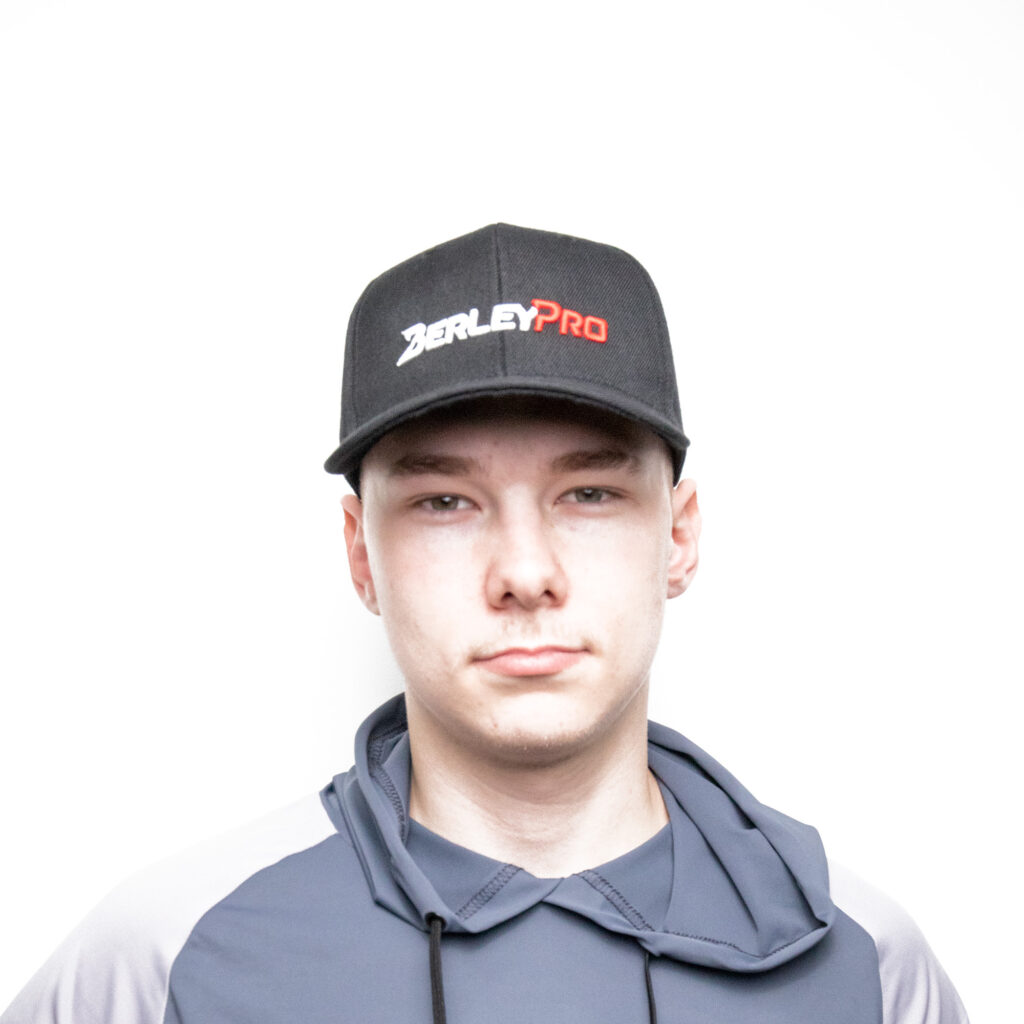 Sporting a sleek black "BerleyPro" cap with that stylish curved bill, paired seamlessly with a gray and dark blue hoodie, this look is all about embracing the brand in effortless style against a clean white backdrop. It's not just gear; it's your everyday adventure uniform.