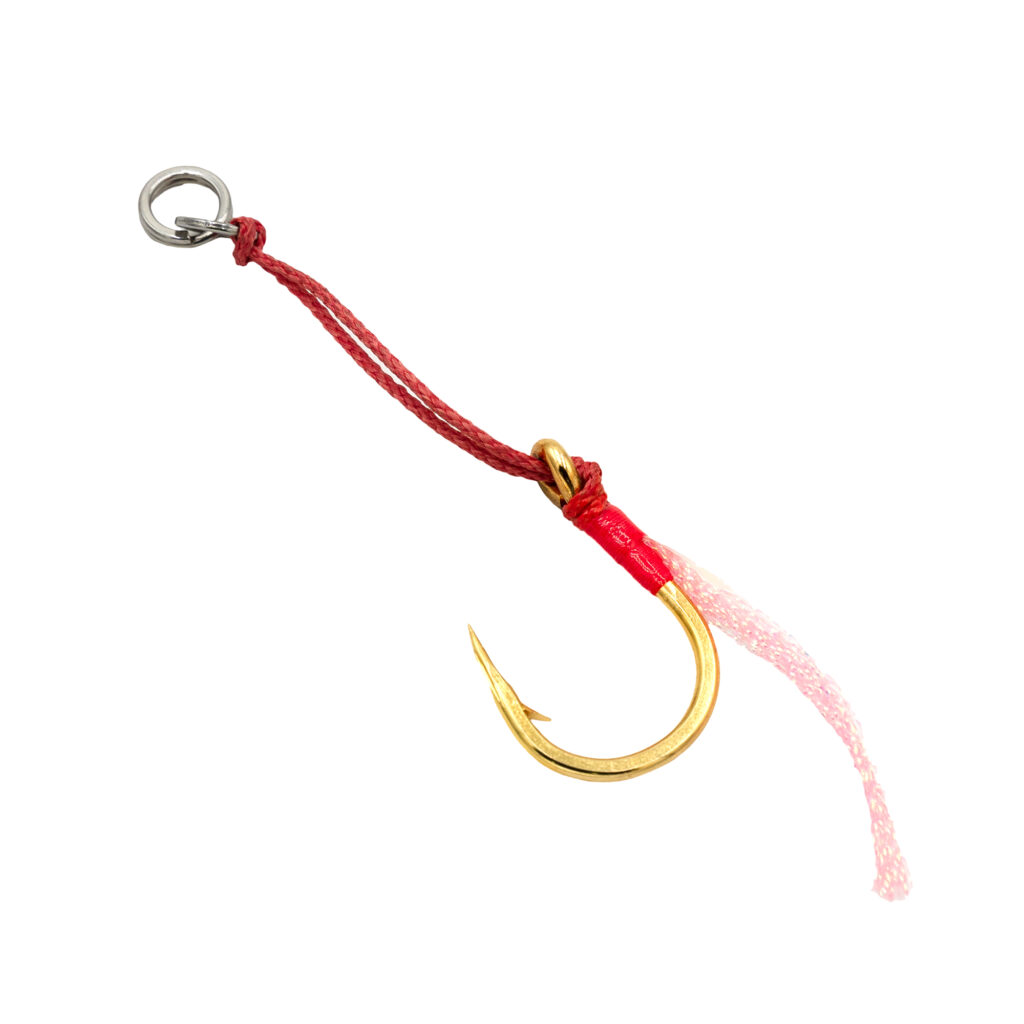 Meet the Jigging Assist Hooks (Heavy) – your new secret weapon for reeling in those hefty monsters! These hooks come decked out with a bold gold finish and a razor-sharp barbed tip, all tied together with vibrant red string. Plus, their robust metal ring ensures they can handle even the most formidable catches. Perfect for when you're serious about bringing in the big ones!.